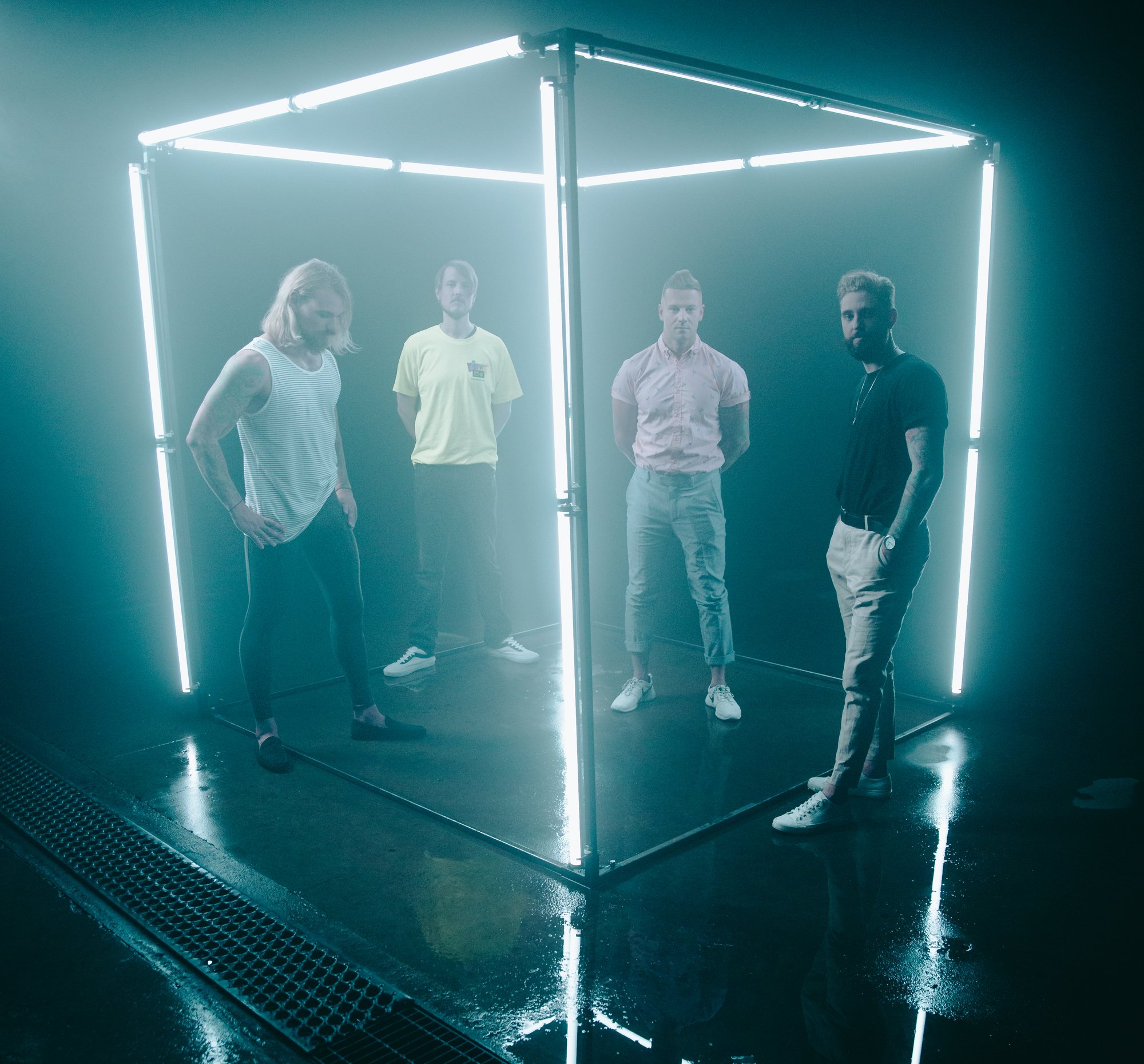 Stereos photographed inside a neon light cube